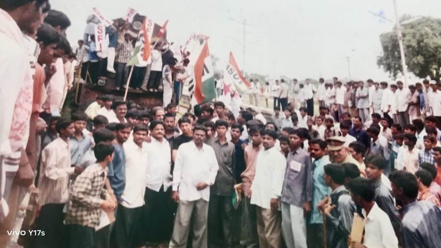 Rail Roko protest with NSUI and party flags on a railway structure